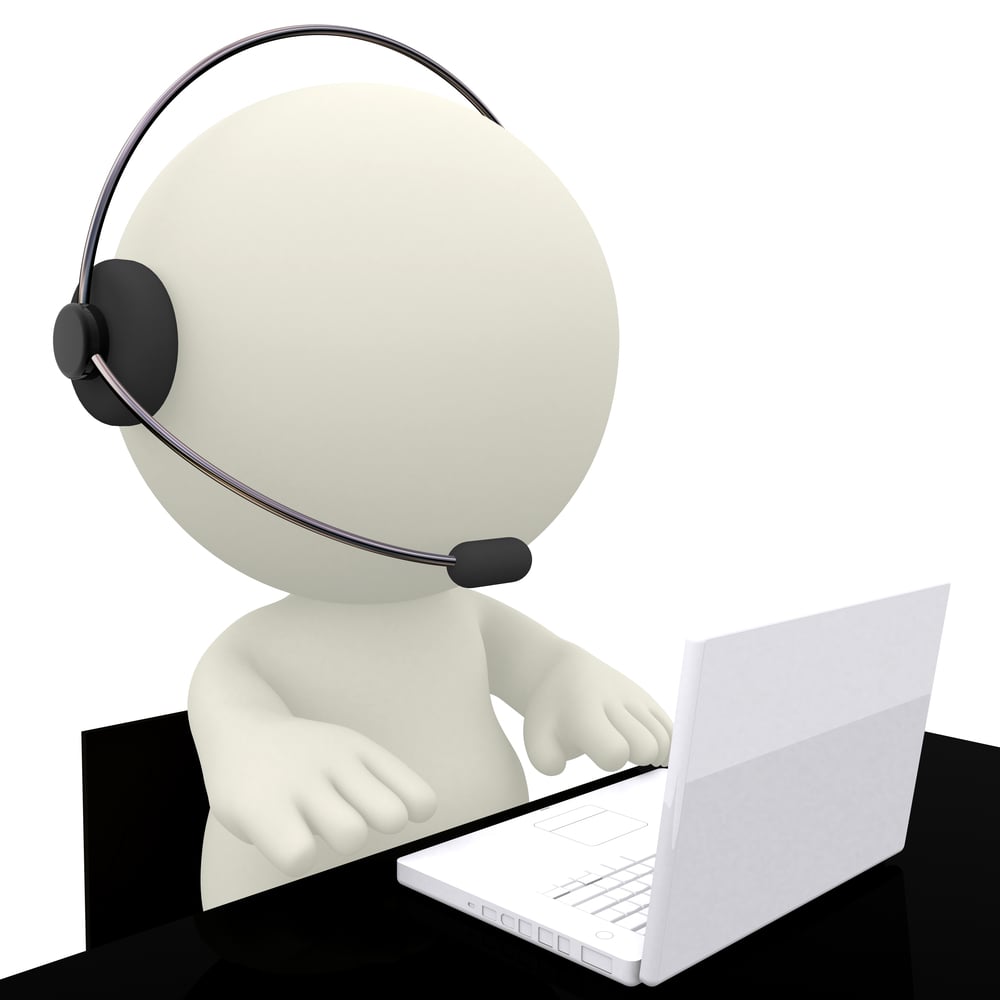 Call center operator sitting at his desk - isolated over a white background