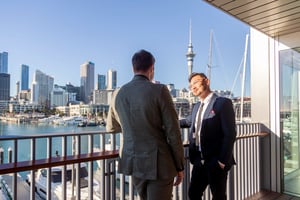 Two men meeting on balcony