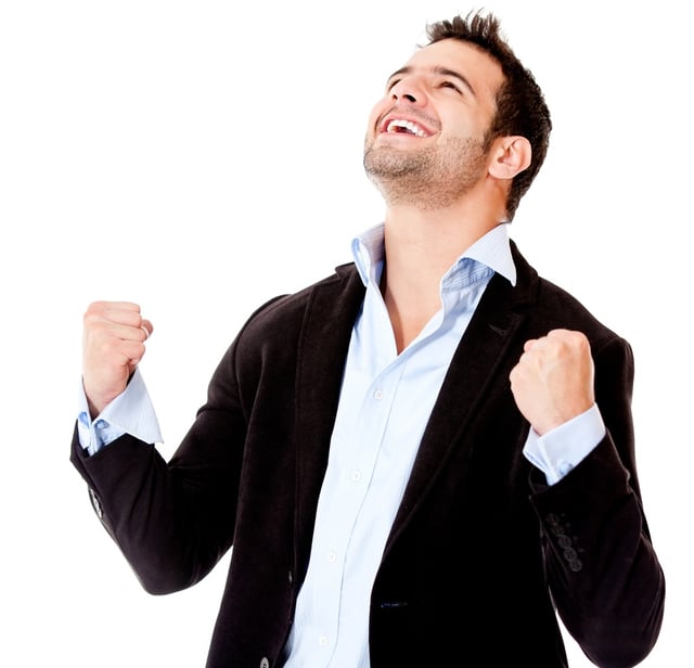 Successful businessman celebrating - isolated over a white background.jpeg